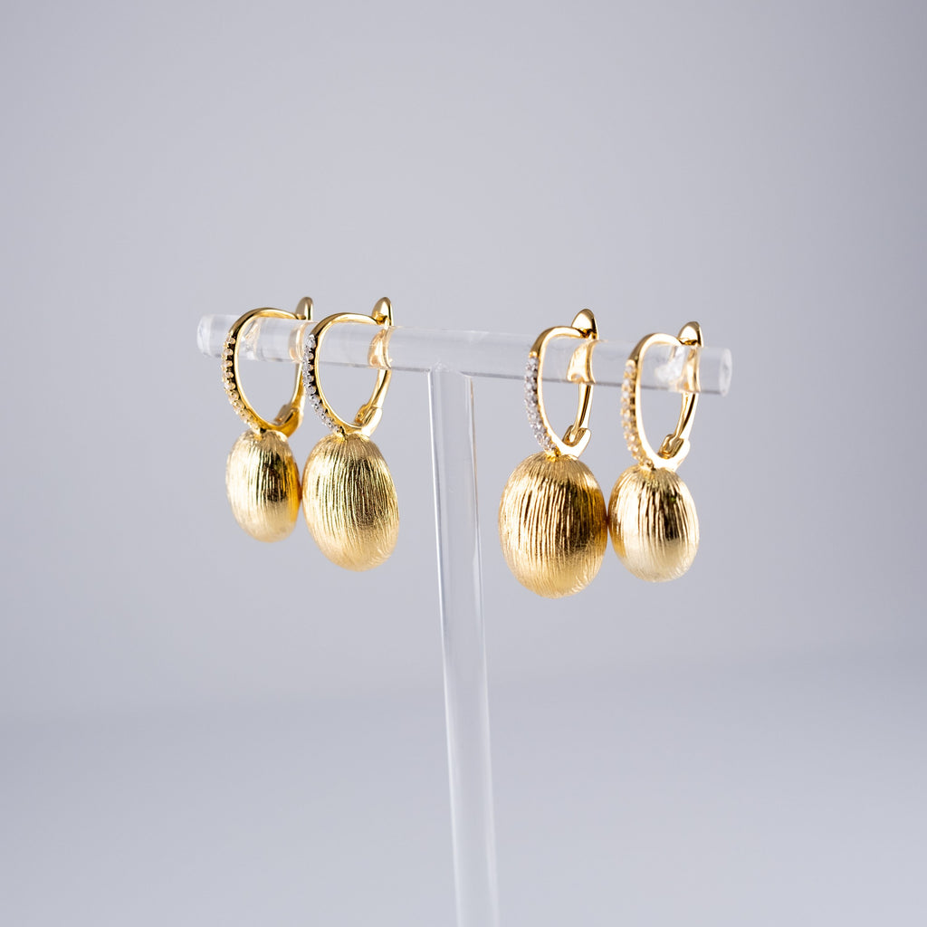 Orecchini Ovali Striati Grandi E Pietre