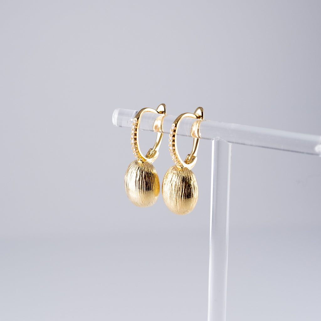 Orecchini Ovali Striati Grandi E Pietre